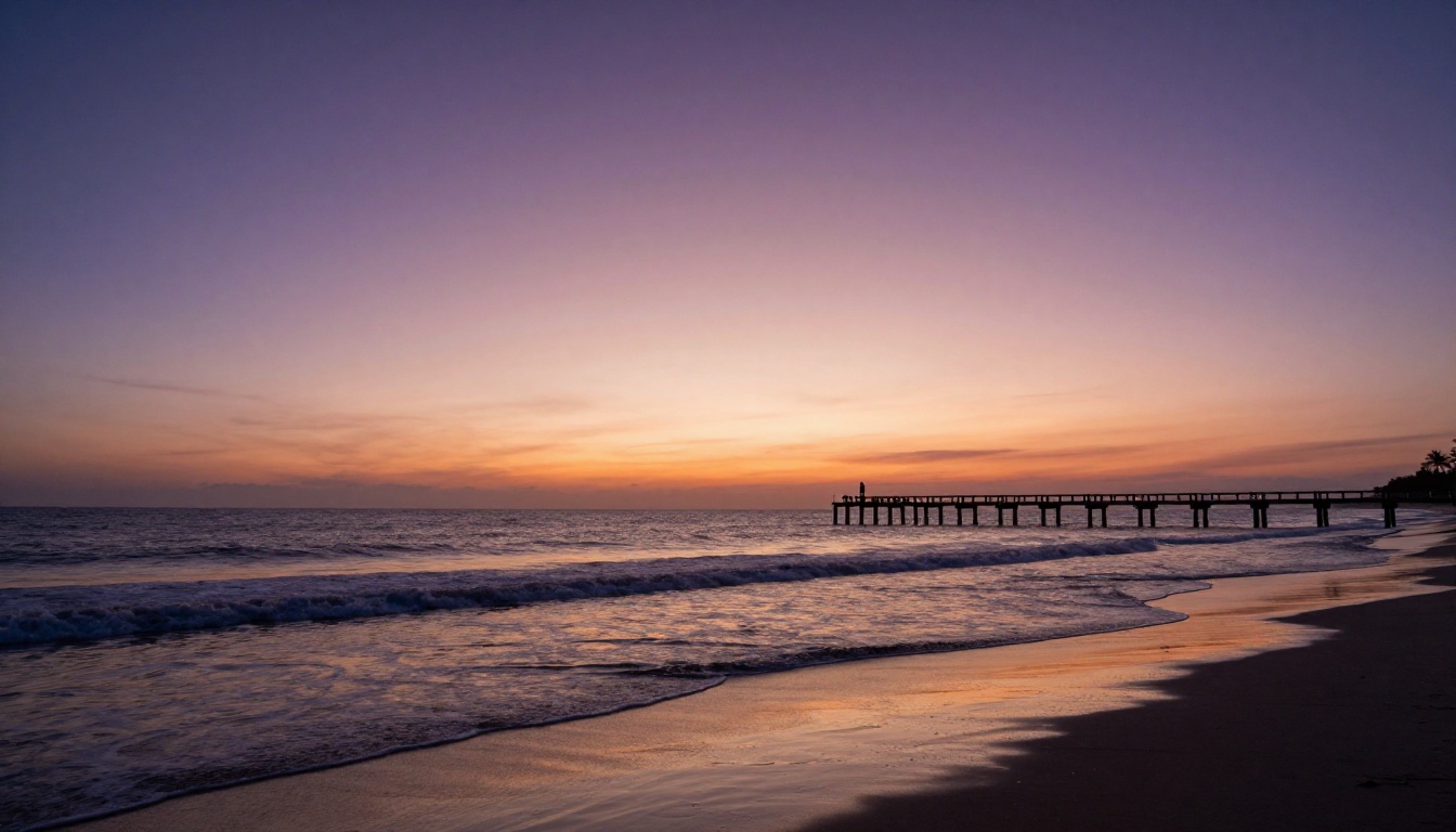 Beach at civil twilight with warm-to-cool sky gradient perfectly reflected on wet sand Beach at civil twilight with warm-to-cool sky gradient perfectly reflected on wet sand