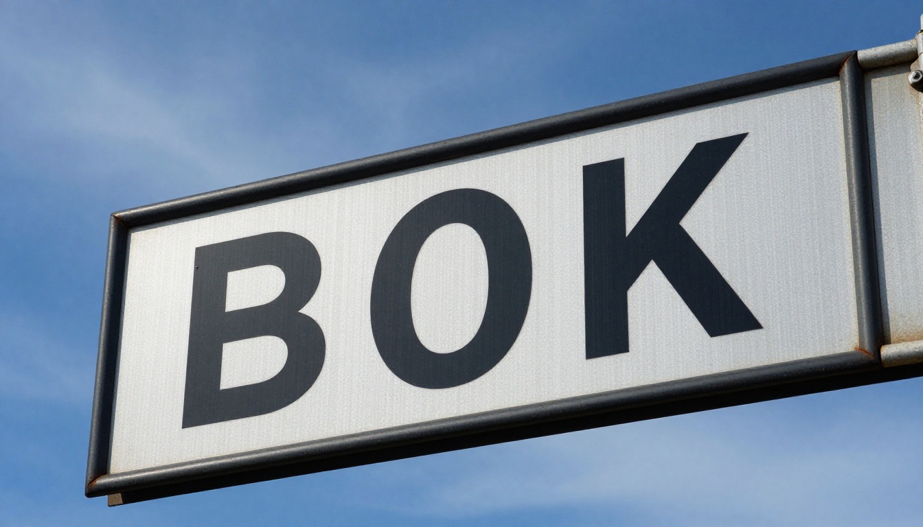 Street sign close-up showing bold sharp sans-serif letterforms against blue sky